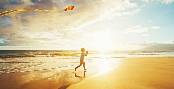 Child with kite at the seaside