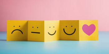 Smileys and heart on notepads