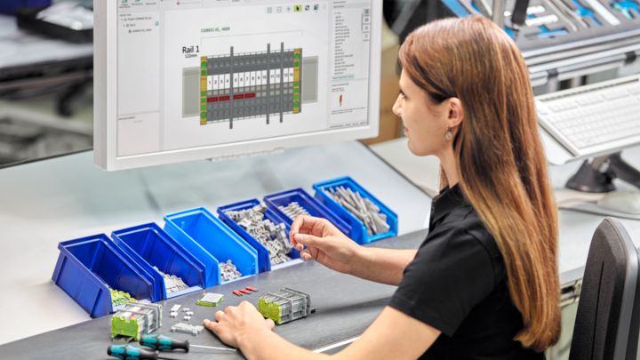 Person producing a terminal strip using digital production documents from clipx&nbsp;ENGINEER